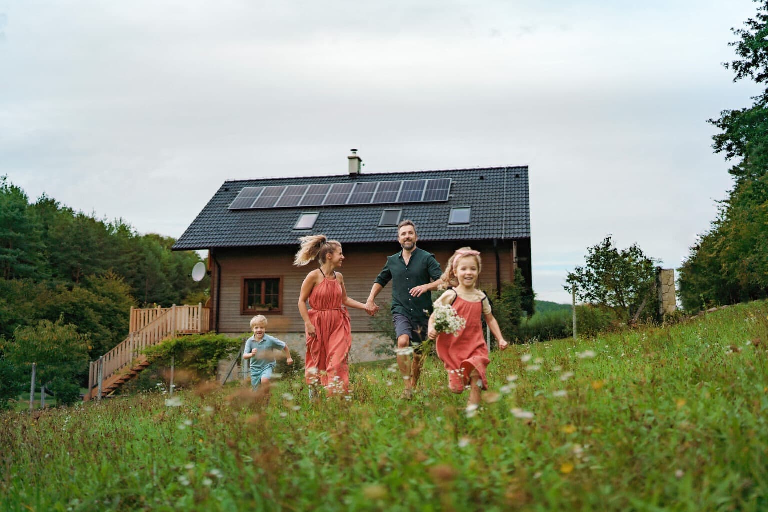happy-family-running-near-their-house-with-solar